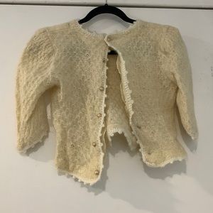 Cream colored faux wool cropped cardigan sweater with padded shoulders, size S.